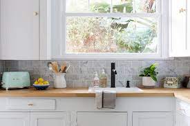 You may already have your other decorative kitchen ideas in place, your wall colors picked out, cabinets designed and an idea of the finish you want from your kitchen worktop, and so which type of countertop material you choose is vital to bring it all to life. Blond Wood Countertops With White Shaker Cabinets Transitional Kitchen