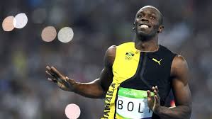 Usain bolt of jamaica (c) smiles as he looks at canada's andre de grasse (r) in the men's 100 with the tokyo olympics postponed to 2021 due to the coronavirus, bolt's flirtation with a 2020. 0rxksceqgvpchm