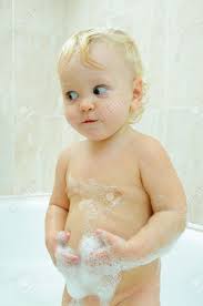 Make a bath pad by putting a clean towel on top of a folded wet baby's head with clear water. Little Boy In Bath With Water And Foam Stock Photo Picture And Royalty Free Image Image 8422160