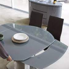 Complete with one compact table with a beveled glass top and two swivel bar stools, this set is crafted from metal in a galaxy bronze finish that blends easily with a variety of color palettes and aesthetics. Volta Extendable Swivel Glass Dining Table In Grey 3 Glass Dining Table Tempered Glass Table Top Steel Dining Table