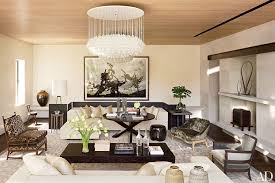 This living space features a sitting area with a designer chandelier, as well as a dining area finished with a pair of pendant dome lights. 19 Statement Making Chandeliers Architectural Digest