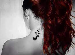 Girl With A Tattoo Of Butterflies On The Back Of Her Neck Neck Tattoo Tattoos Small Butterfly Tattoo