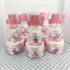 Oh Girl Diaper Cake Centerpieces In 2021 Girl Baby Shower Centerpieces Baby Girl Diaper Cake Diaper Cake Centerpieces