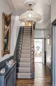 The Large Gold Guilt Mirror Is A Perfect Accent To The Grey Walls And Staircase Wtinteriors Interior Hallway Designs 1930s House Interior Victorian Interior