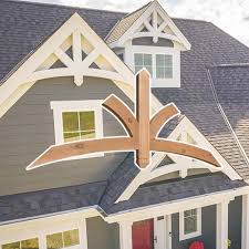 Garage door covered with standing seam metal roof supported by brackets. Cedar Brackets And Corbels Wooden Brackets Wood Brackets Wooden Corbels Wood Corbels Exterior Wooden Brackets Cedar Brackets Cedar Exterior Brackets And Corbels Corbels Rafter Tails By Pro Wood Market