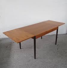 Whether it's a cosy breakfast for two or a game night set for six, an extendable dining table will give you plenty of room to grow. Extendable Vintage Mid Century Teak Dining Table 1960s 162914