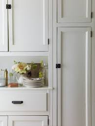 The antique white keeps it on the softer side of the design. Calm And Collected At Home With The Duo Behind Aesthetic Movement Remodelista Black Kitchen Cabinets Kitchen Renovation Black Hardware Kitchen