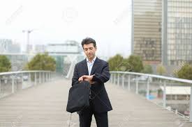 Lawyer fashion evolves to reflect personality and tradition. Lawyer In Business Clothes With Smartphone Waiting For Client Man Standing On Bridge Checking Time On
