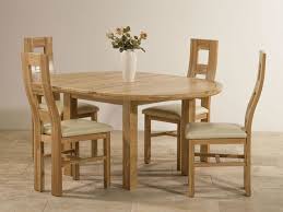 The exceptional value price of the ercol bosco medium extending dining table with 6 slatted dining chairs makes this oak dining set hard to resist. Knightsbridge Natural Solid Oak Dining Set 4ft Round Extending Table With 4 Wave Back And Cream Leather Chairs Looking For A Compact Wood Working In 2019