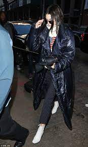 Kendall Jenner Wears Puffer Coat Over Sweater And Pinstripe Pants Dailymail Kendall Jenner Kendall Jenner Street Style High Neck Sweater Outfit