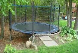 Trampoline On Sloped Ground How To Set Up Gettrampoline Com Backyard Trampoline Garden Trampoline Sloped Backyard