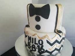 Black And White Bow Tie Cake Bow Tie Black And Gold Baby Shower Cake Gold Baby Shower Cake Baby Shower Cakes Bow Tie Baby Shower