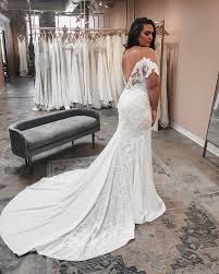 From The Fit To The Off The Shoulder Illusion We Can T Get Enough Of This Showstopper Lovers Society Ha In 2020 Wedding Dresses Lace Sheath Wedding Dress Modern Gown