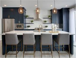 Going for a bolder approach in applying blue, this kitchen uses dark navy blue paint all over its walls. Forever Classic Blue Kitchen Cabinets Centsational Style