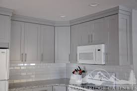 In this case i think a darker gray will create contrast with an easy transition, and the use of accent colors like blue, or yellow, or orange can bring both spaces to life. Pebble Gray Kitchen Stone Ridge Cabinets