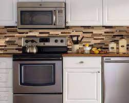 Another idea would be to lay the tiles vertically end to end & use the same idea of accent tiles about every three feet (also vertically). Kitchen Backsplash Tiles That Are A Cinch To Keep Clean