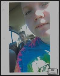 Photo of Abby sitting in car in backseat behind Kelsi. Did they have an  argument in car and Abby messed up Kelsie hair and that's how she got k  hair wrapped in