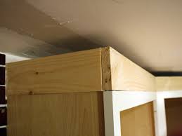 Crown moldings can help draw the eyes from the overlay cabinet, walls, and ceilings. How To Install Cabinet Crown Molding How Tos Diy