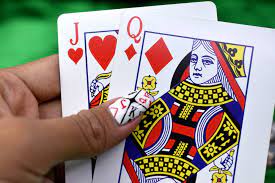 Pitchers across both leagues are not happy with mlb commissioner rob. Person Holding Queen Of Diamonds And Jack Of Hearts Playing Cards Photo Free Human Image On Unsplash