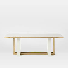 White marble floats effortlessly on svelte metal legs in elegant display ideally sized for art or botanicals. Whitney Rectangular White Gold Dining Table