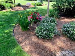 At a depth of 2.5 inches. New England Pine Straw Mulch