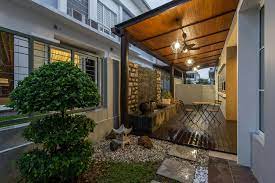 Stairs, bedframes and arched trellis by the front yard patio wear the same shade of brown that lets the hardscape fade into the background so plantings can shine. Garden Interior Design Malaysia Interior Design Ideas