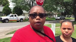 Katherine Mitchell heard a loud boom outside her home in Cheektowaga and  called 911 after a National Grid worker was shocked while working