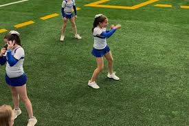 Teen cheerleader in Texas goes viral for her sideline shadowboxing —  because she's also a national champ boxer