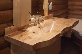 It features two metal sinks and a practical construction with six shelves and lower compartments with double wooden doors and decorative handles. Wooden Sink Theydesign With Regard To Wooden Sink Best Choosing A Wooden Sink Wood Sink Wooden Bathroom Sink