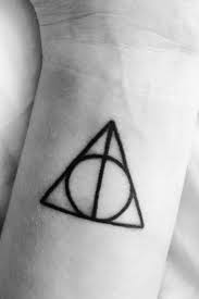 21 Spellbinding Harry Potter Tattoos Every Fan Will Adore Harry Potter Tattoo Small Harry Potter Tattoos Tattoos For Guys