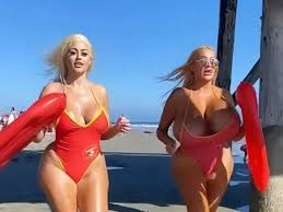 Model with 54-inch boobs recreates iconic Baywatch scene in teeny red  swimsuit - Daily Star