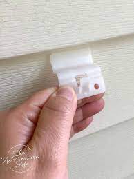 How To Hang Things On Vinyl Siding Without Damaging Your Home In 2020 Vinyl Siding Vinyl Siding Hooks Porch Wall Decor