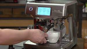Breville coffee machine includes a variety of accessories like water tank, drip tray, bean container and milk frothing system. The Barista Touch Espresso Machine Breville