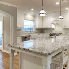 Kitchen white granite countertops with white cabinets. 5 Shocking Reasons Why You Should Use Granite For Your Kitchen Countertop Kitchen Remodel Countertops White Granite Kitchen White Granite Countertops