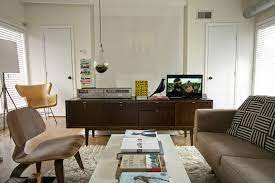 Modern interior design is shaped by a heritage of clean lines, geometric form, clear spaces, function and storage. I Like The Pieces And A Hanging Terrarium Is A Way To Get An Earth Element Small Living Room Decor Mid Century Modern Interior Design Interior Design Furniture