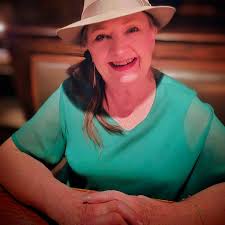 What is the significance of the early 1900s postcard with the Indianola  girl?