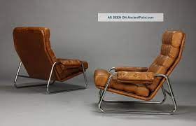 Danish lounge chair & footstool in leather (2102101) $2,250.00. Pair Of Danish Leather Lounge Chairs With Sculpted Metal Frames Midcentury Mcm Leather Lounge Chair Danish Leather Lounge Chair Leather Chair