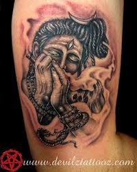 Amazing black ink trishul with pellet drum tattoo on forearm. Tattoos God Shiva New Tattoo Zone