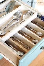 Our kitchen isn't huge, although updates like painting the melamine cabinets white and updating the track lighting made it feel significantly bigger! Diy Double Layer Drawer Organization Remodelando La Casa