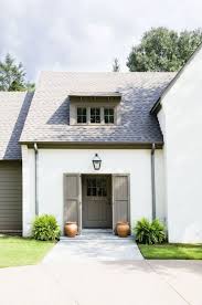 Chicago designer explains picking greige paint colors for her vintage home. Love The White House With The Grey Green Greige Door And Trim I Think You Could Do The Door Shutter Farmhouse Exterior Exterior House Colors House Exterior