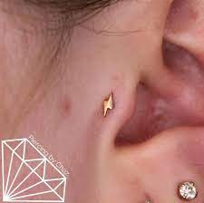 Piercingbychaz On Instagram Fresh Tragus Piercing With A Little Gold Lightning Bolt From Leroifinejewelry Lightn Tragus Piercings Piercing Tragus