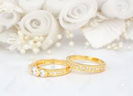 Maybe you would like to learn more about one of these? Gold Wedding Rings On Flowers Background Stock Photo Picture And Royalty Free Image Image 9672042