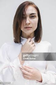 110 Woman Adjusting Collar Stock Photos, High-Res Pictures, and Images