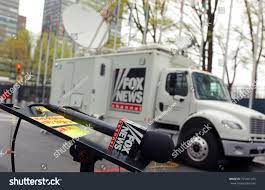 New York Usa 04 27 2017 Microphone Of A Fox News Tv Reporter In Front Of A Broadcasting Truck With Satellite Dishmicro Tv Reporter Stock Photos Fox News Tv