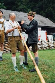 Brad Learning The Alphorn With Help From Austrian In Lederhosen Austrian Beer Beer Tours Alphorn