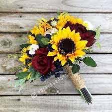 Soft yellow roses and bright sunflowers make a wonderful combination, don't bold and brilliant wedding bouquet with yellow roses. Sunflower Bouquet Sunflower Wedding Bouquet Boho Sunflower Sunflower Wedding Bouquet Wedding Flowers Sunflowers Beach Wedding Flowers