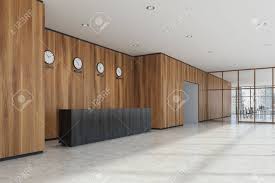 Wood walls look great when you highlight them wood walls such as this one were introduced as a way to balance out the raw concrete, steel and the. Dark Wooden Reception Desk In A Modern Office With Wooden Walls Stock Photo Picture And Royalty Free Image Image 87851921