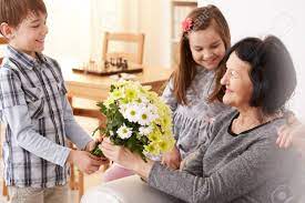Maybe you would like to learn more about one of these? Happy Grandchildren Giving A Bunch Of Flowers To Their Grandma Sitting On A Sofa Stock Photo Picture And Royalty Free Image Image 76957071
