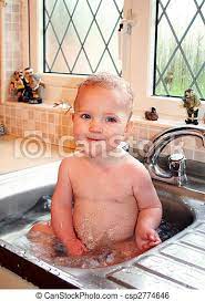 Child Baby Sink Bath Child Bath In Kitchen Sink Baby Splash And Play In Water Canstock