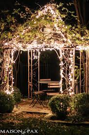 Arbor With Christmas Lights And A Bistro Table And Chairs Fairy Lights Garden Outdoor Fairy Lights Outdoor Christmas Lights